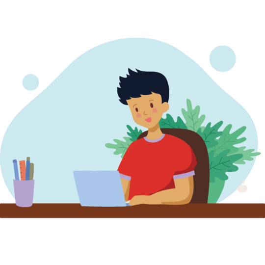 A boy with dark hair is sitting at a desk using a light blue laptop. He wears a red t-shirt and has a cheerful expression. There are colorful pens in a cup next to him, and green plants are visible in the background.